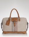 Make a clean getaway with this utterly stylish weekender from BOSS Black, structured with a leather base for support and striped down the front with a handsome print, the perfect bag for your short trips out of town.