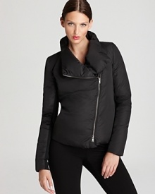 Infuse your outerwear repertoire with modern edge as an asymmetrical zip punctuates the plush body of this DKNY puffer jacket. Infuse your outerwear repertoire with modern edge as an asymmetrical zip punctuates the plush body of this DKNY puffer jacket.
