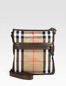 Iconic check printed cotton, in slim, crossbody design, with rich leather trim.Zip closureExterior, interior zip pockets83% cotton/17% polyurethane11W x 12½HMade in Italy Iconic check printed cotton, in slim, crossbody design, with rich leather trim.Zip closureExterior, interior zip pockets83% cotton/17% polyurethane11W x 12½HMade in Italy