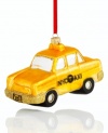 Hail this fun taxi cab ornament for a holiday filled with New York cheer. Featuring gold glitter accents on painted glass for a look of glamorous uptown style. With 2012 license plate.