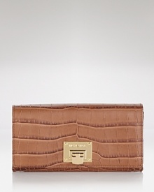 This effortless wallet captures the cosmopolitan essence of MICHAEL Michael Kors with its slim profile and sophisticated leather.
