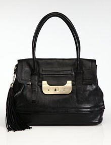 Sumptuous leather in a roomy top-handle carryall, finished with polished goldtone hardware and an oversized tassel.Double top handles, 7 dropTurnlock flap closureOne outside open pocketProtective metal feetOne inside zip pocketCenter zip compartmentThree inside open pocketsCotton lining14¾W X 11H X 6½DImported Sumptuous leather in a roomy top-handle carryall, finished with polished goldtone hardware and an oversized tassel.Double top handles, 7 dropTurnlock flap closureOne outside open pocketProtective metal feetOne inside zip pocketCenter zip compartmentThree inside open pocketsCotton lining14¾W X 11H X 6½DImported
