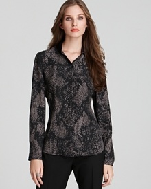 Your staple accent piece for fall: This T Tahari snake-print blouse brings eye-catching chic to everyday style.