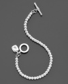 Enjoy streamlined style with a trendy silvertone metal bead bracelet (4 mm) from Lauren Ralph Lauren featuring a cute logo charm and toggle closure. Length measures 7-1/2 inches.