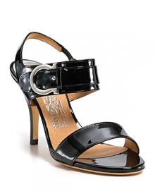In gleaming metallic patent, the Brianna sandals boast the brand's signature gancio detail at the ankle. From Salvatore Ferragamo. In gleaming metallic patent, the Brianna sandals boast the brand's signature gancio detail at the ankle. From Salvatore Ferragamo.