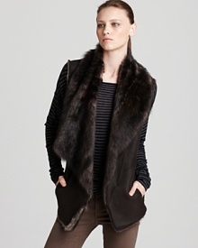 Exude city sophistication in a Vince shearling vest featuring an elegant draped collar with sumptuous--and über-soft--lamb fur for the perfect touch of decadence.