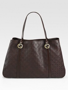 Guccissima leather with interlocking G ornaments, leather trim and nickel hardware.Double top handles, 8 drop Snap closure Protective metal feet Inside zip, cell phone and PDA pockets Fully lined 17¾W X 11¾H X 4D Made in Italy Guccissima leather with interlocking G ornaments, leather trim and nickel hardware.Double top handles, 8 drop Snap closure Protective metal feet Inside zip, cell phone and PDA pockets Fully lined 17¾W X 11¾H X 4D Made in Italy