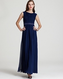 This finely pleated Aidan Mattox gown is accentuated with a dazzling beaded waistband for optimum glamour.