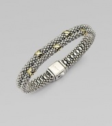 Beautifully textured sterling silver with radiant 18k gold accents in a stunning double row design. Sterling silver18k goldDiameter, about 2¼Box clasp closureImported 