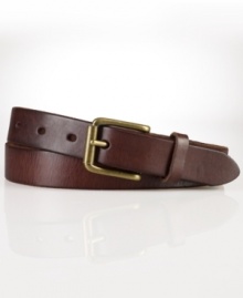 A slim leather belt is embellished with an antiqued brass buckle for a classic, timeworn aesthetic.