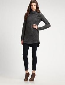 This chunky knit of wool and alpaca skims the body in an elongated silhouette.Turtleneck Raglan sleeves Shirttail hem Ribbed trim Pullover style 45% wool/25% alpaca/30% polyamide Dry clean Imported