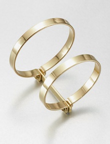 Two bold bangles, joined together, have an industrial screw-in design that enhances their simple drama.BrassDiameter, about 2.75Width, about 1.75Imported Two bold bangles, joined together, have an industrial screw-in design that enhances their simple drama.BrassDiameter, about 2.75Width, about 1.75Imported