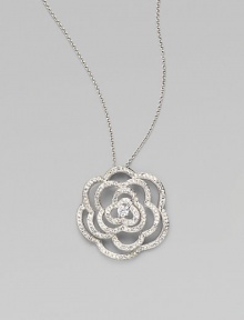 EXCLUSIVELY AT SAKS. The petals of our open flower pendant are paved with dazzling crystals and accented with a center stone of cubic zirconia. Cubic zirconia and crystal Rhodium plated Chain length, about 16 with 2 extender Pendant diameter, about 1½ Lobster clasp Imported
