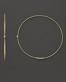 Single diamonds wink from the center of these delicate 14K gold hoops. Single diamonds wink from the center of these delicate 14K gold hoops.