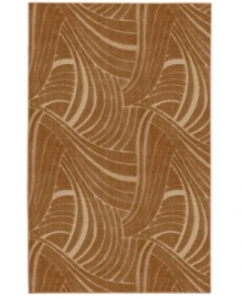 An ultra-modern waving pattern in rich apple butter creates beautiful movement in the Casual Concepts area rug. Durable, stain-resistant olefin fibers are woven with a high/low nap to produce an interesting and invitingly sculpted look. Crafted completely in the USA. An ultra-modern waving pattern in rich apple butter creates beautiful movement in the Casual Concepts area rug. Durable, stain-resistant olefin fibers are woven with a high/low nap to produce an interesting and invitingly sculpted look. Crafted completely in the USA.