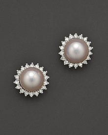Cultured pearl stud earrings with a halo of diamonds. Cultured pearl stud earrings with a halo of diamonds.