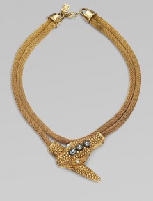 A remarkable piece with a dual row of twisted chains and a gemstone adorned snake head and tail. 14K goldplated Lapis and hematite stones Length, about 18 Lobster clasp closure Pendant width, about 3 Made in USA A remarkable piece with a dual row of twisted chains and a gemstone adorned snake head and tail. 14K goldplated Lapis and hematite stones Length, about 18 Lobster clasp closure Pendant width, about 3 Made in USA