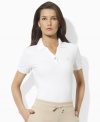 A classic cotton petite polo shirt is crafted for chic, athletic style with a single snap closure and pincord piping for a sporty finish, from Lauren by Ralph Lauren. (Clearance)