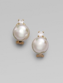 A lustrous round white pearl stud, with a sparkling cubic zirconia accent, set in 18k gold vermeil. 12mm white round organic man-made pearls Cubic zirconia 18k gold vermeil 14k gold post Post-and-hinge back Made in Spain A lustrous round white pearl stud, with a sparkling cubic zirconia accent, set in 18k gold vermeil. 12mm white round organic man-made pearls Cubic zirconia 18k gold vermeil 14k gold post Post-and-hinge back Made in Spain