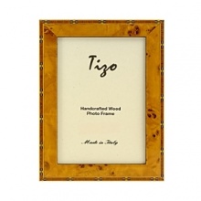 Exquisitely detailed with inlaid marquetry and a high gloss finish, these Italian wood frames offer a perfect way to showcase your pictures. Available in three sizes. Exquisitely detailed with inlaid marquetry and a high gloss finish, these Italian wood frames offer a perfect way to showcase your pictures. Available in three sizes.