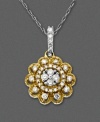 A diamond pendant that boasts a unique vintage-inspired design. You will cherish this 14k two tone necklace with multitudes of glistening round-cut diamonds (1/3 ct. t.w.). Approximate length: 18 inches. Approximate drop: 3/4 inch.