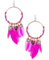 Feathery and fashionable. Betsey Johnson's antique gold tone mixed metal earrings feature fun fuchsia feathers and blue and black leopard flowers, green leaves, and crystal accents all dripping from fuchsia wrapped hoops. Approximate drop: 6 inches. Approximate diameter: 2-1/4 inches.