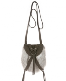 Cozy up to a hot trend this cool season: faux fur embellished with real suede in a crisscrossing wraparound design. Sophisticated silver ring hardware ties the look together. Cozy up to a hot trend this cool season: faux fur embellished with real suede in a crisscrossing wraparound design. Sophisticated silver ring hardware ties the look together.