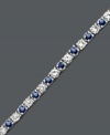 A tennis bracelet to tantalize the senses. This sterling silver bracelet features interchanging round-cut white sapphire (2-3/4 ct. t.w.) and sapphire (2-1/2 ct. t.w.). Approximate length: 7 inches.