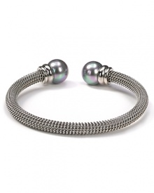 Majorica's steely gray bangle exudes cool confidence. Solo or stacked, wear yours at cocktail hour to give night time looks a strong spin. Majorica's steely gray bangle exudes cool confidence. Solo or stacked, wear yours at cocktail hour to give night time looks a strong spin.