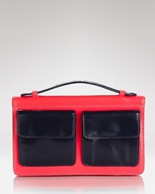 Get a handle on the color block trend with MARC BY MARC JACOBS' patent leather clutch. Boasting bold pockets and a boxy shape, this mini pops with denim and a camel coat.