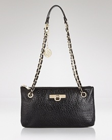 High shine hardware gives this sleek convertible bag from DKNY a hit of cool. Style it over the shoulder or tuck it under your arm to tap this bag's versatile appeal. High shine hardware gives this sleek convertible bag from DKNY a hit of cool. Style it over the shoulder or tuck it under your arm to tap this bag's versatile appeal.