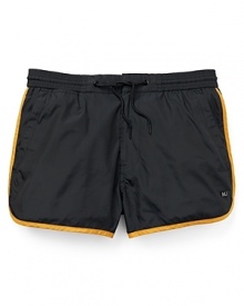 Inspired by vintage gym shorts, this playful pair of swim trunks from MARC BY MARC JACOBS offers a fun-in-the-sun design with contrast piping and a vented leg opening.