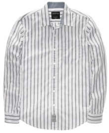 Streamline your look with this easy-wear striped shirt from Calvin Klein.