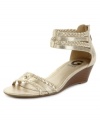 Capture everyone's attention. G by Guess' Interest demi wedge sandals feature a metallic sheen and braided straps.