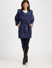 A double-breasted A-line design featuring a fold-over collar, a convenient hood and front pockets. Attached hoodThree-quarter sleevesButton closureFront pocketsBelted designAbout 34 from shoulder to hemNylonHand washImportedModel shown is 5'9½(176cm)wearing US size 4. A double-breasted A-line design featuring a fold-over collar, a convenient hood and front pockets. Attached hoodThree-quarter sleevesButton closureFront pocketsBelted designAbout 34 from shoulder to hemNylonHand washImportedModel shown is 5'9½(176cm)wearing US size 4.