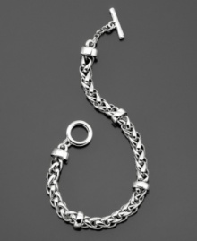 Smooth, sleek and always stylish. This silvertone mixed metal braided chain bracelet by Lauren by Ralph Lauren features a toggle & bar closure. Approximate length: 8 inches.