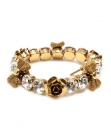 Slip some sweet style and sparkle over your wrists with this chic Betsey Johnson bracelet. Bracelet stretches to fit the wrist and features rows of round-cut crystal, flower and ribbon charms. Crafted in antique gold tone mixed metal. Approximate diameter: 2-1/4 inches.