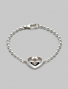 From the Love Britt Collection. Signature interlocking G in an iconic heart shape accents the wrist beautifully. Sterling silver Width of heart, about ¾ Length, about 6½ Lobster clasp closure Made in Italy 