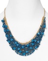 Brighten up every outfit with this layered beaded bib necklace from Cara accented by a dramatic collar of blue stones.