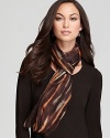 A light breeze enlivens the blurred print atop this Eileen Fisher scarf for a chic style statement.