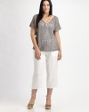 Shimmer and shine in this airy knit enhanced by metallic thread. It also features a feminine neckline and beloved fit.V-neckShort sleevesPull-on styleAbout 23 from shoulder to hem83% linen/16% metallic thread/1% cottonHand washImported of Italian fabric