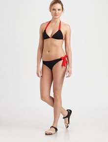 A modern design with contrasting self-tie details for a fashion-forward look and sexy fit. Triangle cupsContrast halter strap ties at neckBack tie closure80% polyamide/20% elastaneFully linedHand washImported of Italian fabricPlease note: Bikini bottom sold separately. A modern design with contrasting self-tie details for a fashion-forward look and sexy fit. Triangle cupsContrast halter strap ties at neckBack tie closure80% polyamide/20% elastaneFully linedHand washImported of Italian fabricPlease note: Bikini bottom sold separately.