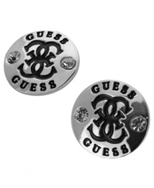 Classic cool. GUESS's trendy button stud earrings feature the signature quattro G logo. Crafted in silver tone mixed metal with jet epoxy and sparkling crystal accents. Approximate diameter: 1/2 inch.