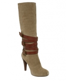 Wrap star! Leather strap embellishment serves as distinctive detailing on Nine West's tall suede Verydisco boots. With an almond-toe silhouette, buckle hardware and a high covered heel, they'll be a chic counterpart to a slim skirt.