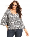 Complete your casual looks with MICHAEL Michael Kors' printed plus size top, punctuated by a banded hem.