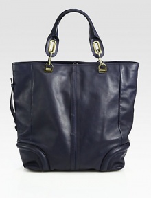 Butter-smooth calfskin in an oversized top handle carryall.Double top handles, 6½ dropTop hook closureProtective metal feetOne inside zip pocketOne inside open pocketCotton lining12¾W X 14¼H X 6½DImported