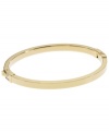 Dress up your look with a simple layer. Michael Kors thin polished bangle looks great solo, but is perfect for stacking! Crafted in gold tone mixed metal. Approximate width: 1/8 inch. Approximate diameter: 2-1/4 inches.