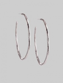 Delicate yet dramatic hoops of hammered sterling silver. Sterling silver Diameter, about 1¾ Post back Imported Delicate yet dramatic hoops of hammered sterling silver. Sterling silver Diameter, about 1¾ Post back Imported