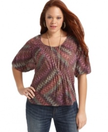 Rock a boho vibe with American Rag's elbow sleeve plus size top, cinched by a smocked waist