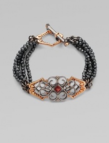 From the Les Dents de la Mer Collection. The distinctive jagged shape of a shark's jaw is artfully woven into the filigree design of this pretty and witty five-strand bracelet of faceted hematite beads with a garnet accent.Red garnetHematiteRose goldplated sterling silver and black rhodium-plated sterling silverLength, about 7¾Shark jaw toggle claspImported From the Les Dents de la Mer Collection. The distinctive jagged shape of a shark's jaw is artfully woven into the filigree design of this pretty and witty five-strand bracelet of faceted hematite beads with a garnet accent.Red garnetHematiteRose goldplated sterling silver and black rhodium-plated sterling silverLength, about 7¾Shark jaw toggle claspImported